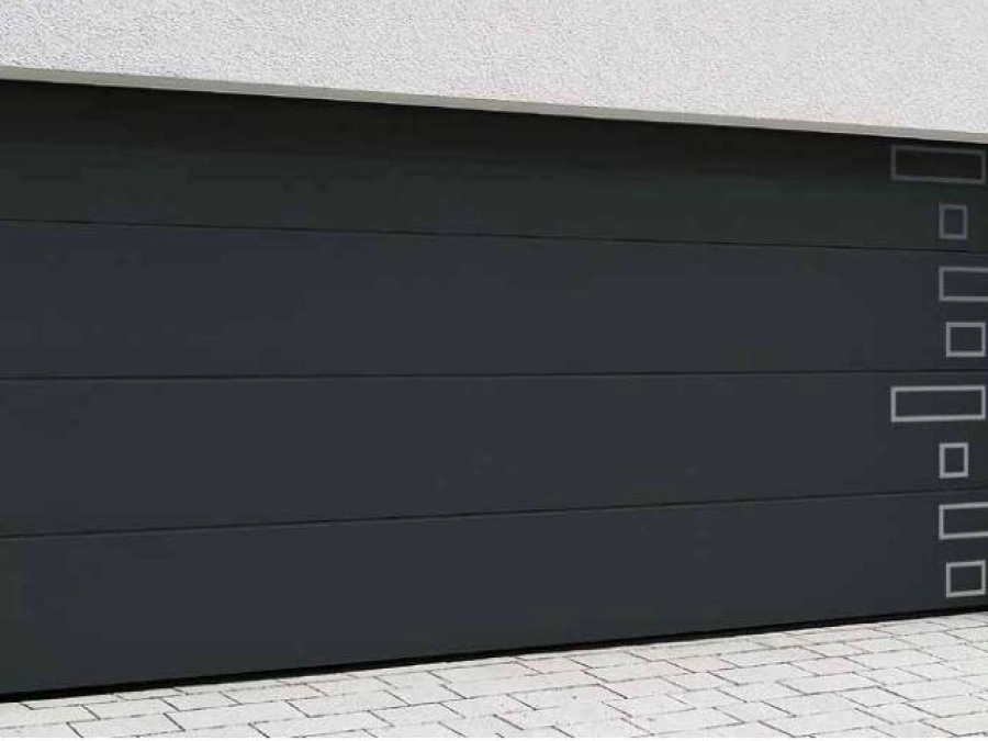 Porte de garage latérale anthracite AFC aux inserts métal design, façade blanche Calvados.